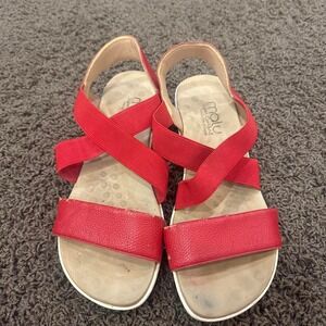 Red leather sandals with white sole
